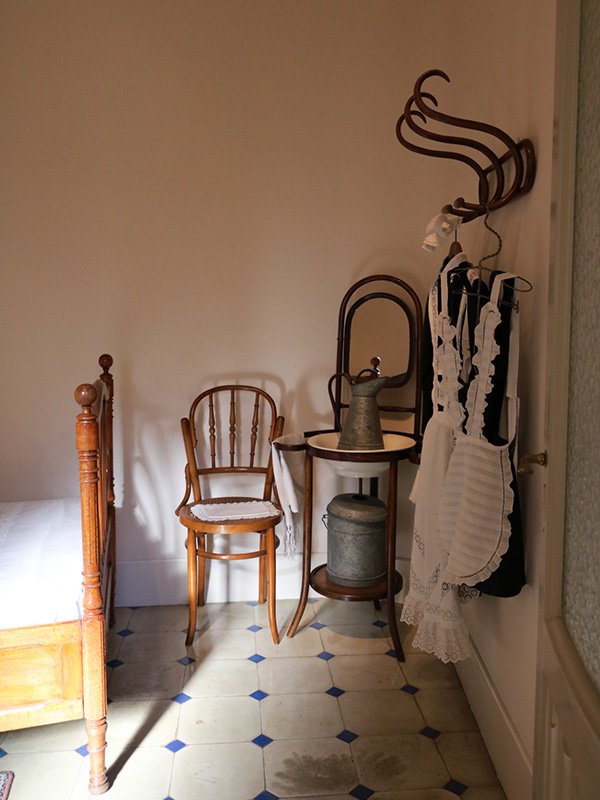 Casa Mila in Barcelona Casa Milà bedroom interior in Barcelona with antique washstand and grooming accessories by Antoni Gaudí