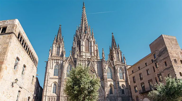 Exterior façade of the Barcelona Cathedral showing its Gothic architecture and central entrance in the Gothic Quarter