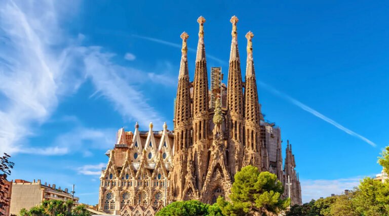 Exterior view of the Sagrada Família showing its intricate towers and detailed façades in Barcelona