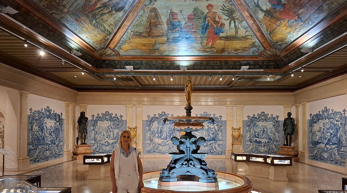 Traveler standing inside exhibition halls of Almeida Museum viewing art displays