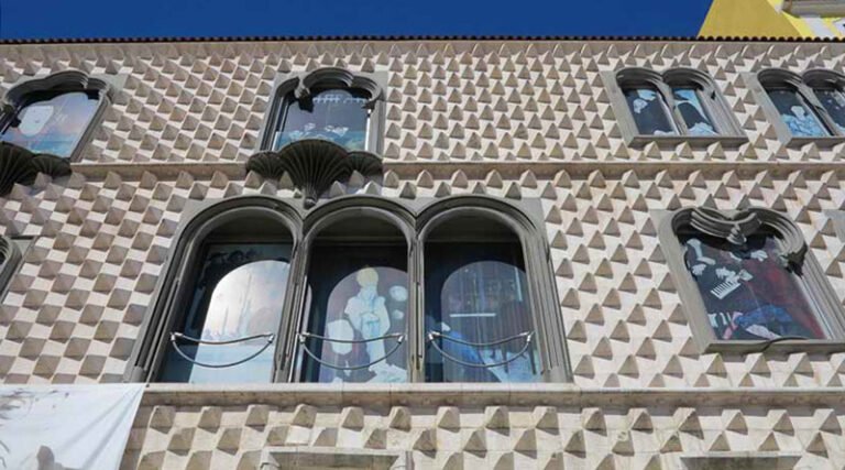 Exterior view of Casa dos Bicos showing its distinctive façade and surrounding plaza in Lisbon