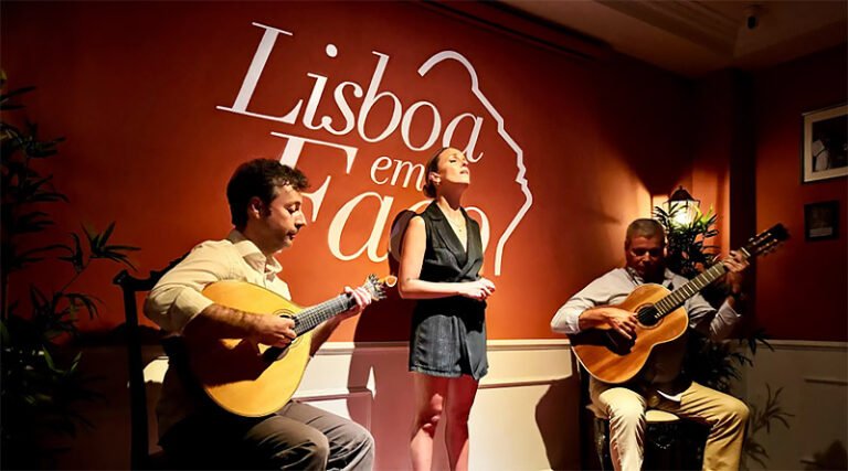 Live fado performance with musicians and singer performing inside a traditional venue in Lisbon