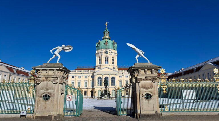 Exterior view of the Charlottenburg Palace in Berlin showcasing baroque architecture and palace gardens