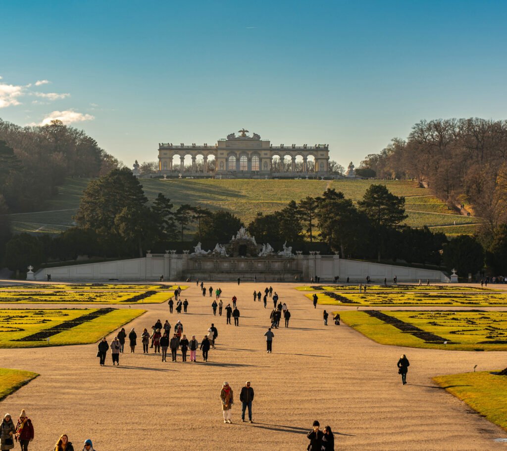 Exterior view of the Schönbrunn Palace showing its baroque façade and formal gardens