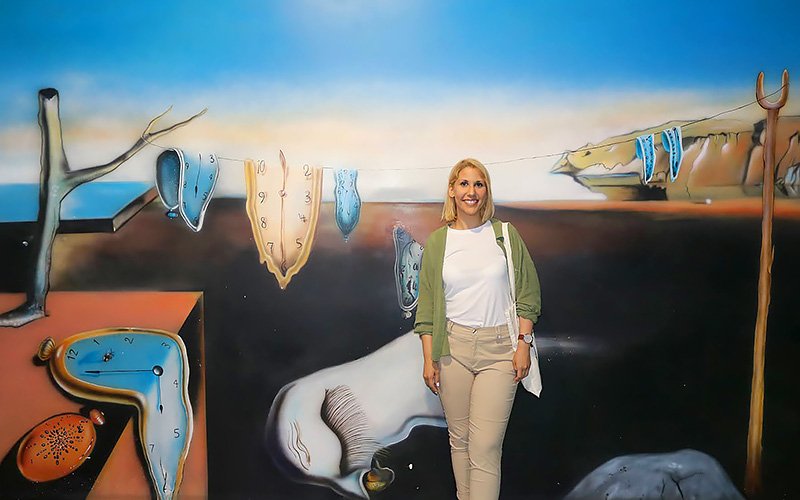 Traveler standing inside the Museum of Illusions in Barcelona surrounded by optical illusion exhibits and interactive displays