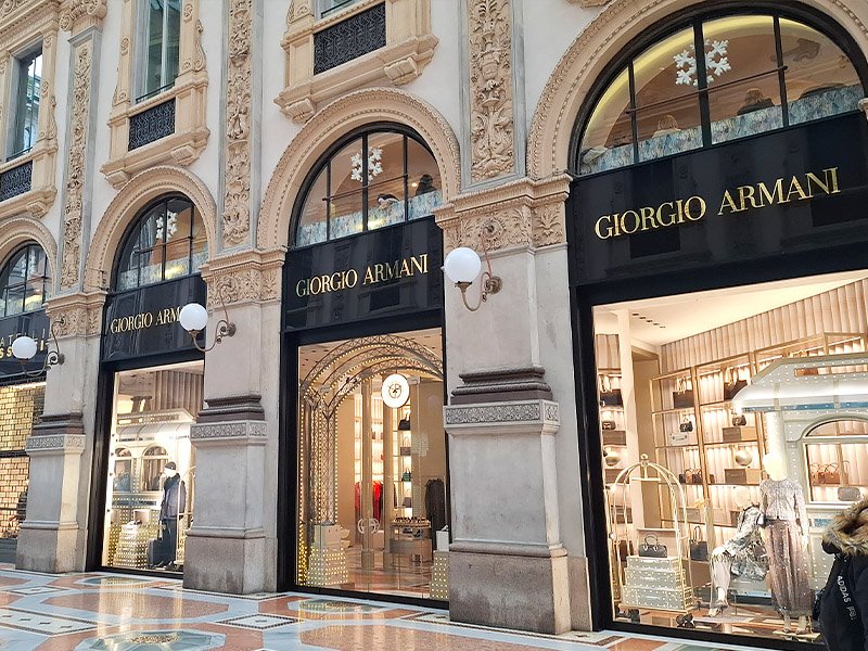 Giorgio Armani storefront inside Galleria Vittorio Emanuele II in Milan, blending minimalist luxury fashion with historic architecture.