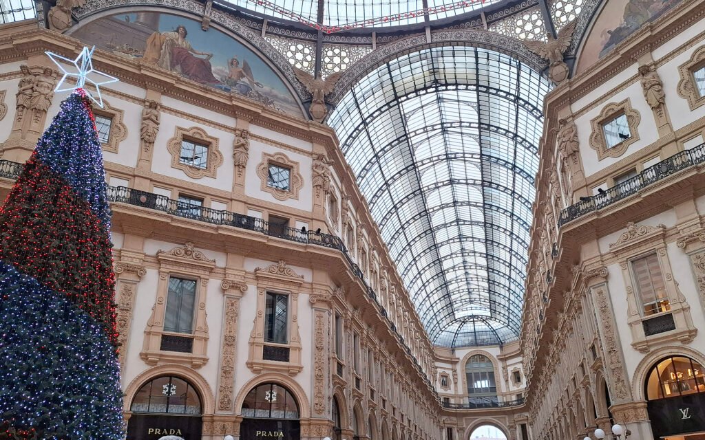 MILAN, ITALY Central interior of Galleria Vittorio Emanuele II in Milan, showcasing the glass dome, elegant arches, and luxury shops.