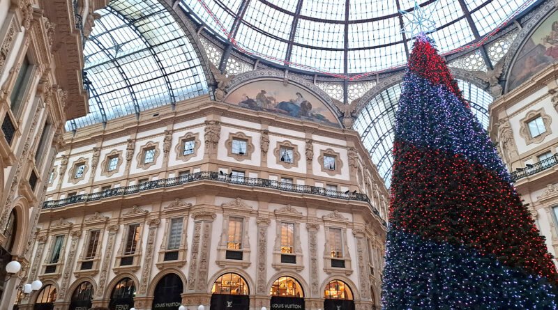Central interior of Galleria Vittorio Emanuele II in Milan, showcasing the glass dome, elegant arches, and luxury shops.