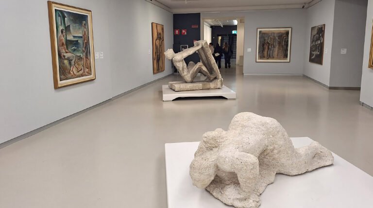 Sculptures displayed in a gallery room of Museo del Novecento in Milan, featuring modern Italian art from the 20th century.
