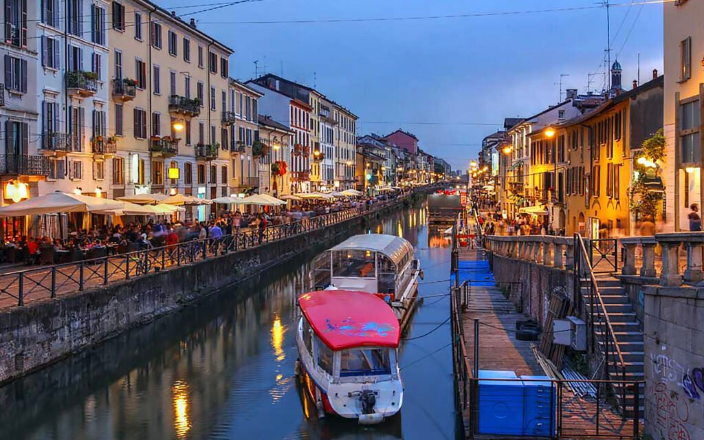 MILAN, ITALY Scenic view of the Navigli canal in Milan’s Navigli District, featuring waterway reflections and historic buildings along the canal.