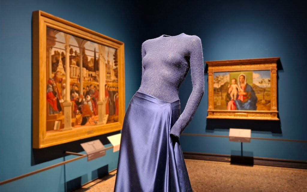 MILAN, ITALY Giorgio Armani fashion creation displayed in Pinacoteca di Brera, Milan, with paintings from the permanent collection in the background.