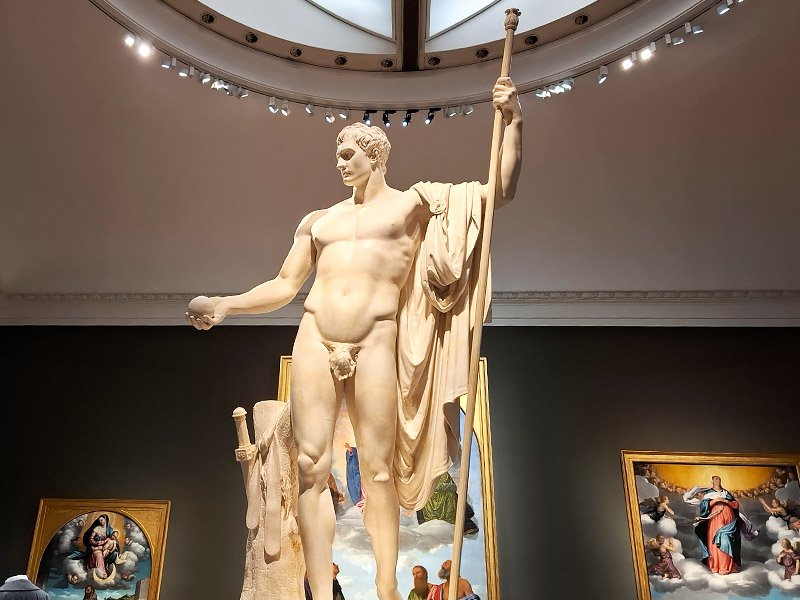 Sculpture of Napoleon as Mars the Peacemaker by Antonio Canova on display inside the Pinacoteca di Brera museum in Milan, blending neoclassical form with artistic heritage.