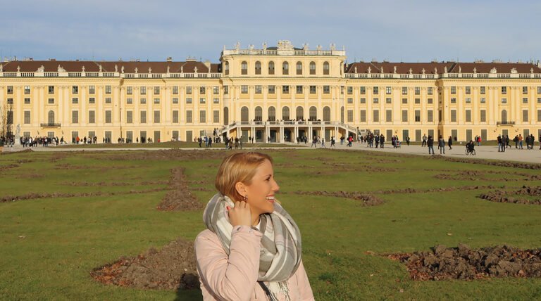 Standing in front of Schönbrunn Palace, one of the best palaces to visit in Vienna